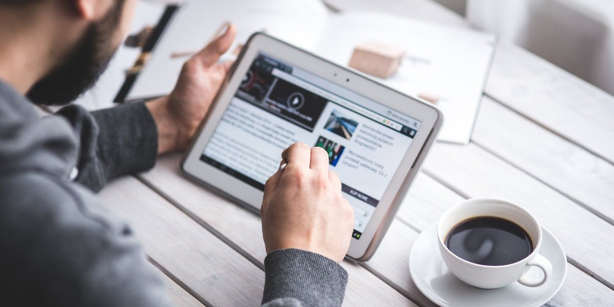 man-on-tablet-looking-at-resources-for-Your-Daily-Walk